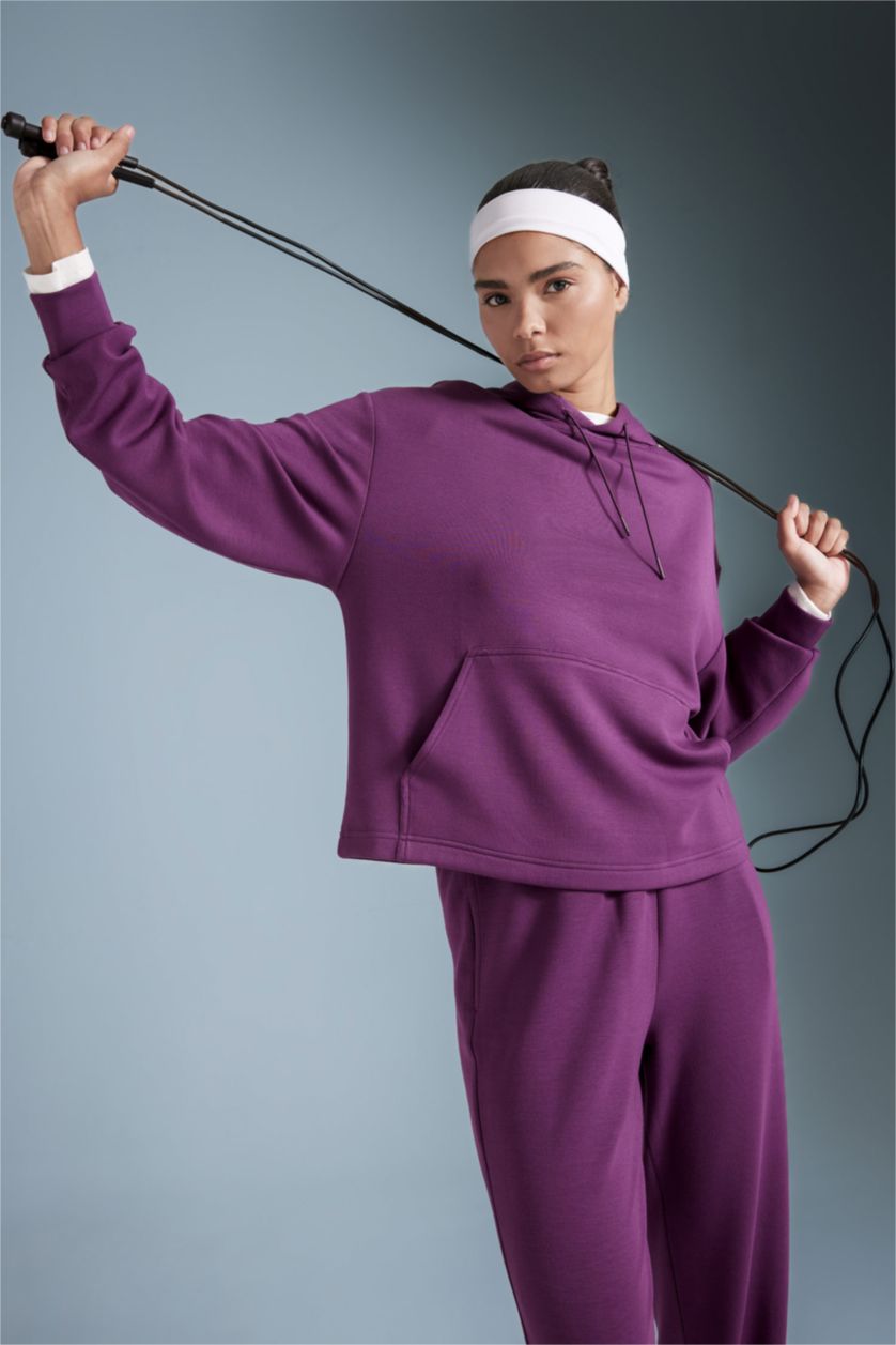 نساء اللون البرقوقي سويت شيرت رياضي واسع برقبة عالية بجيب من DeFactoFit