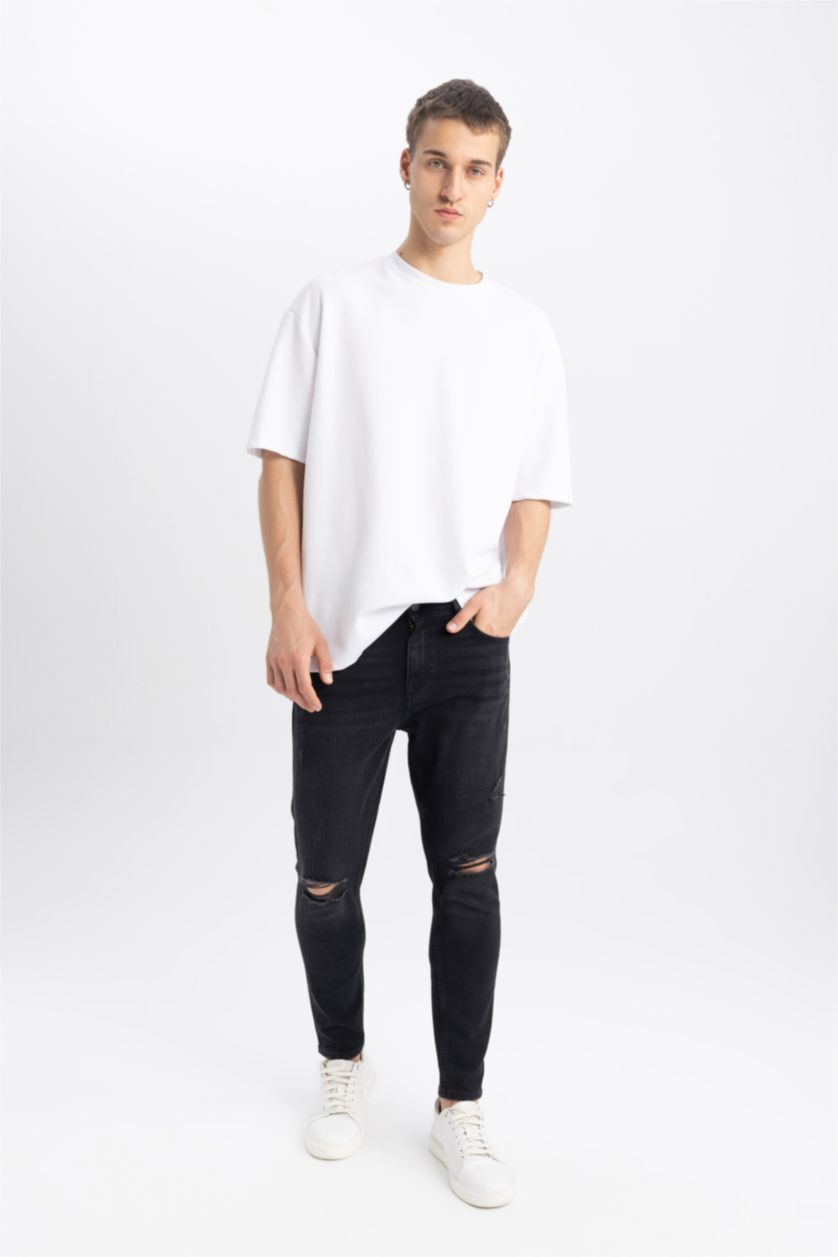 HOMME Noir Pantalon Jean Coupe Carotte avec Détails Déchirés