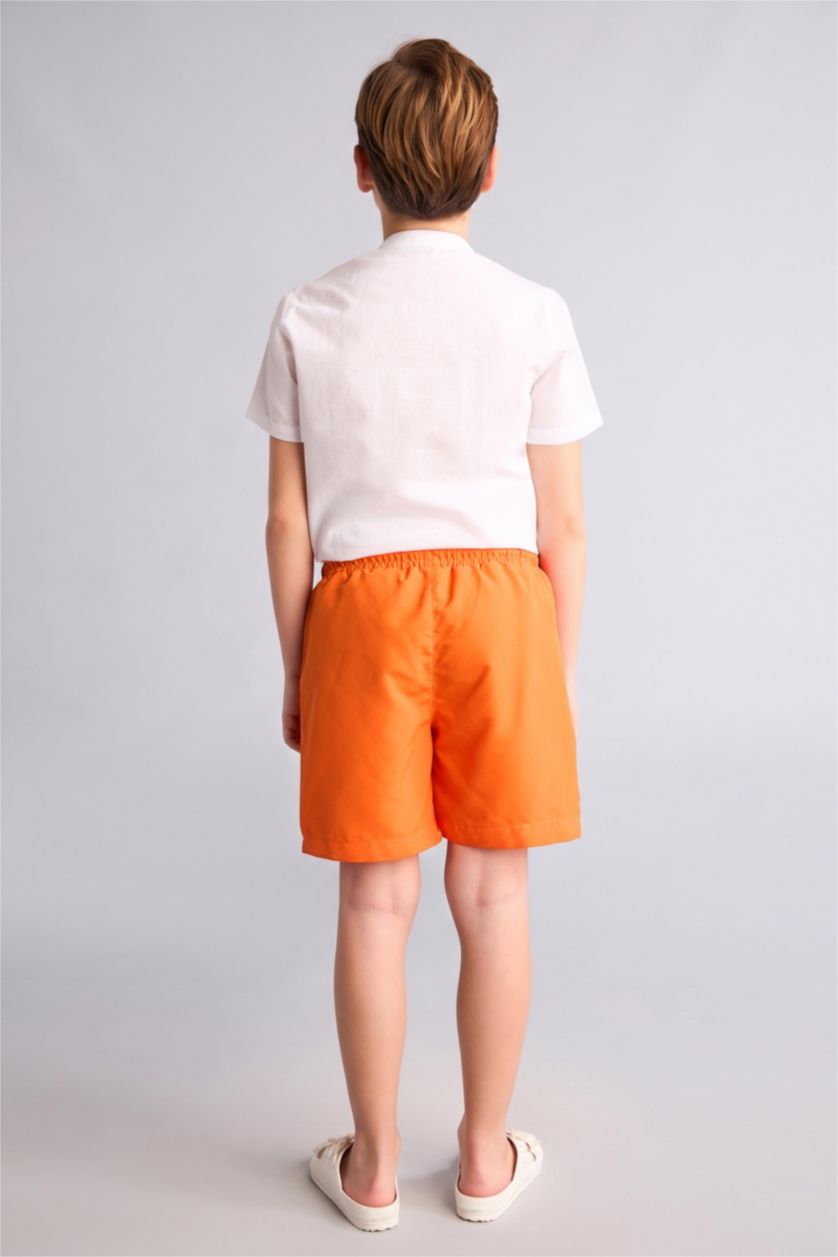 أولاد برتقالي شورت بحر بيزك