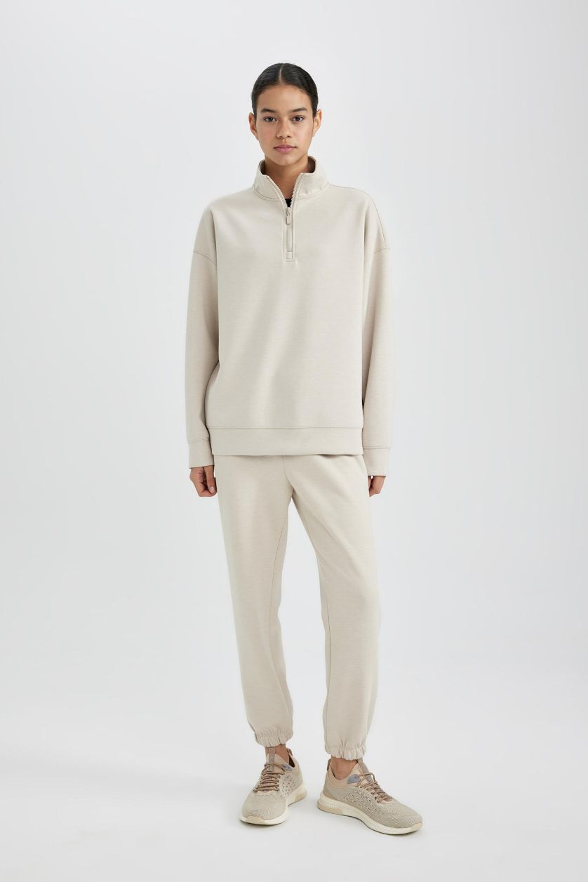 نساء اللون الرملي سويت شيرت رياضي اوفر سايز بياخة عالية بنصف سحاب من DeFactoFit