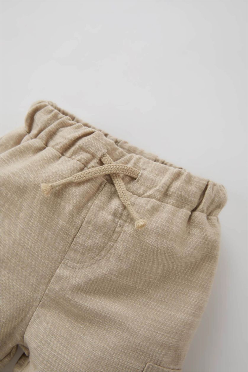 طفل صغير اللون الرملي بنطلون بيبي اولادي قصة عادية