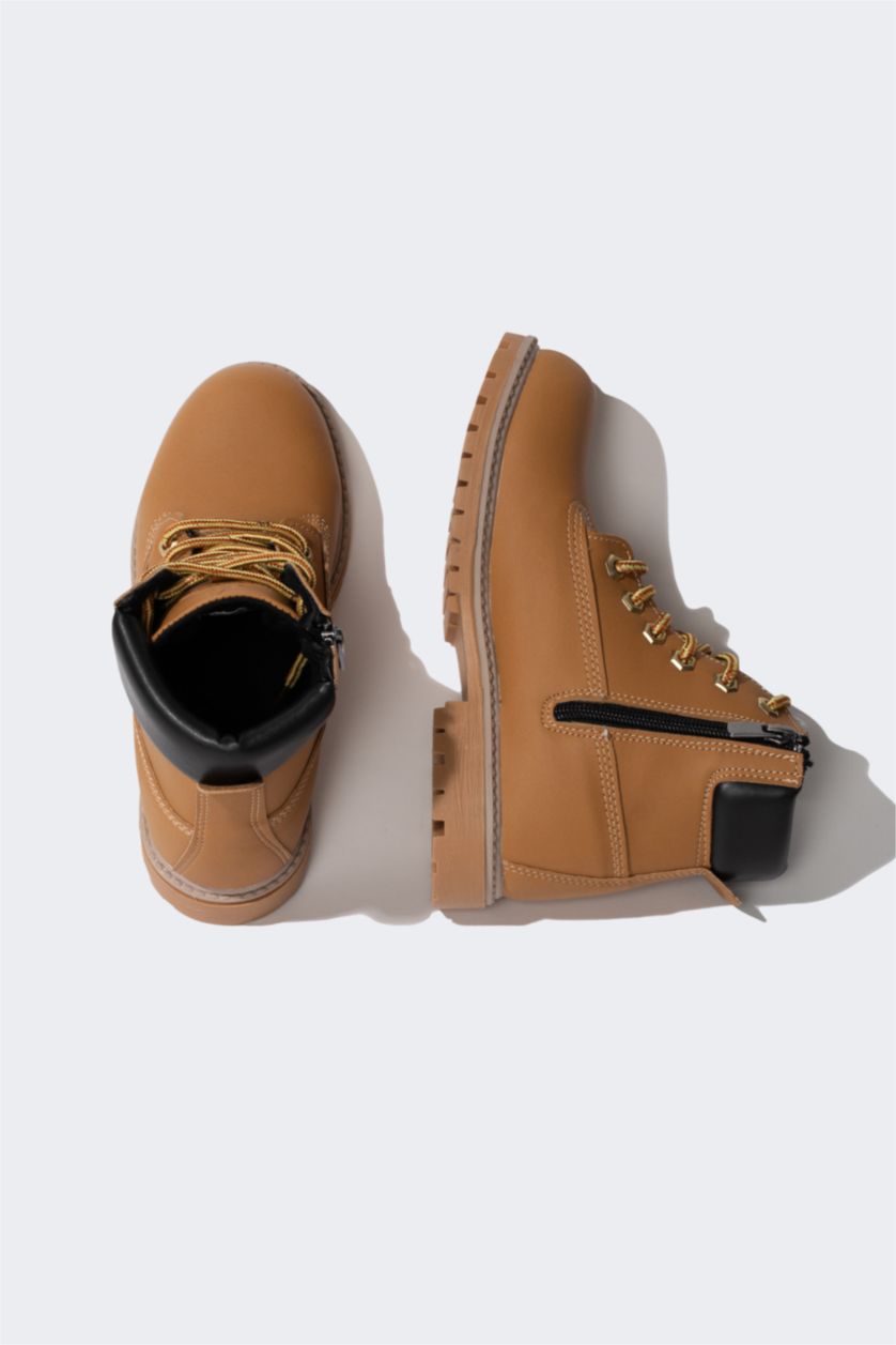 أولاد خزان بوت ولادي جلد صناعي بكعب مسنن برباط وسحاب