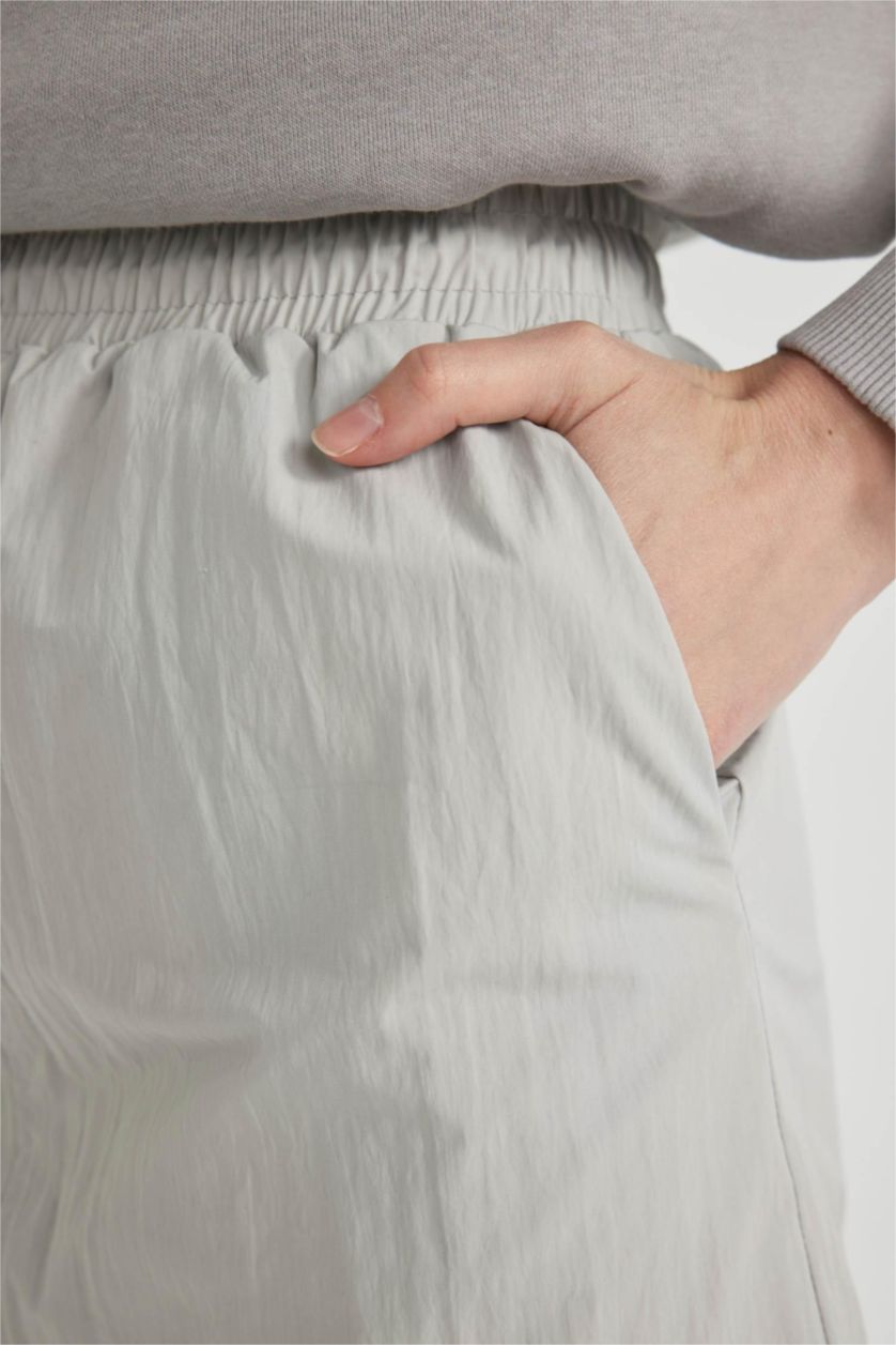 حريمي رمادي فاتح جيبة طويلة باراشوت بقصة A