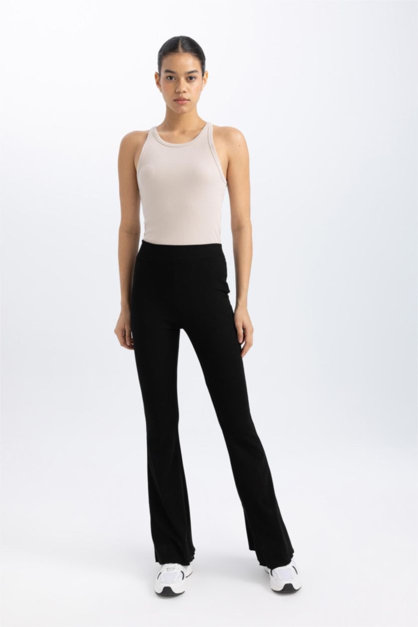 Woman Black DeFactoFit Flare Fit Standard Length Ribbed Trousers