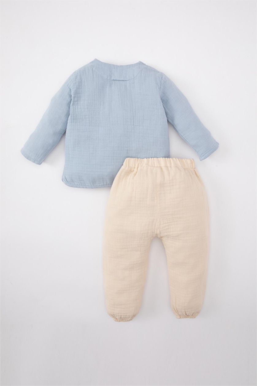 مولود ذكر أزرق فاتح طقم ولادي قميص وسروال موسلين - قطعتين
