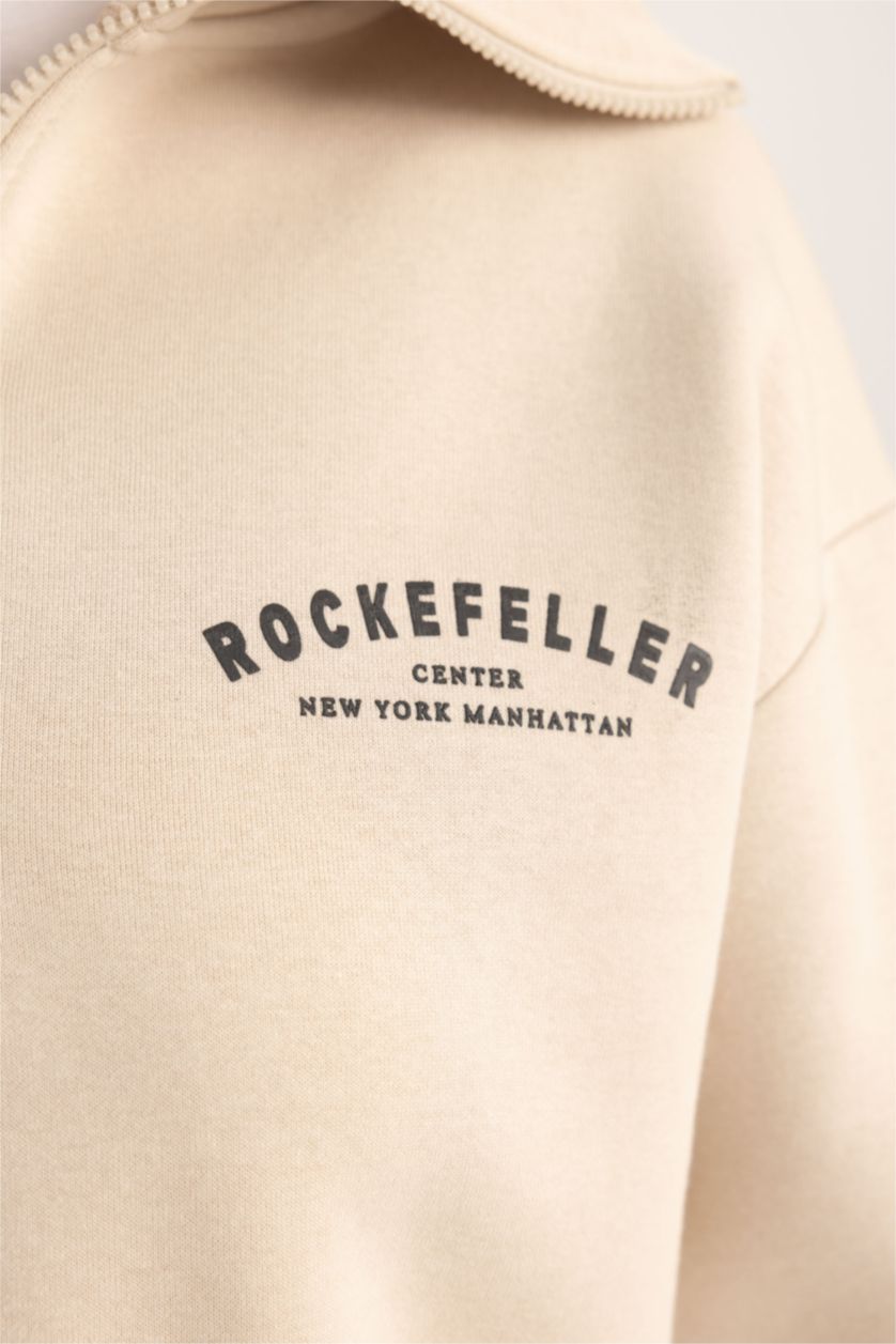 حريمي بيج سويت شيرت بطبعة شعار قصة مريحة بياقة نص سوسته