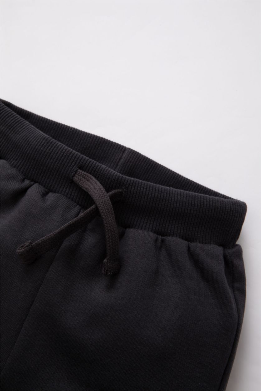 مولود ذكر أنثرا بنطلون سويت بانتس ولادي بطبعة شعار وقصة عادية