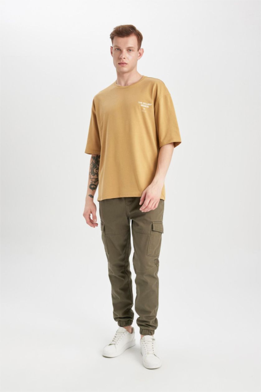 رجال أصفر تيشيرت قصة فضفاضة مطبوع برقبة مستديرة
