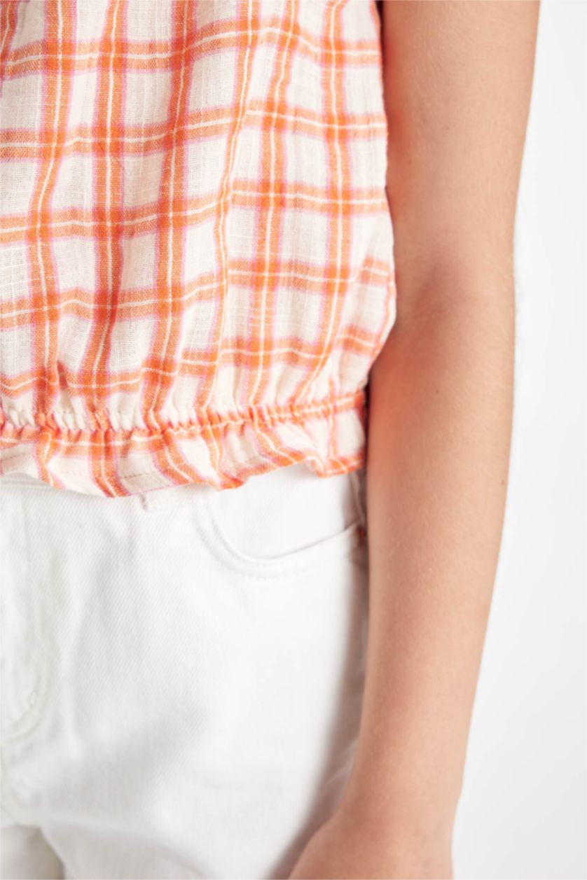 بنات برتقالي فاتح بلوزة كاروهات بناتي بحمالات