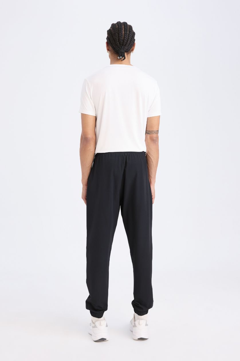 Erkek Siyah Dokuma Esnek Multifonksiyonel Sporcu Jogger Eşofman Altı Slim Fit Dar Kesim Çift Cepli
