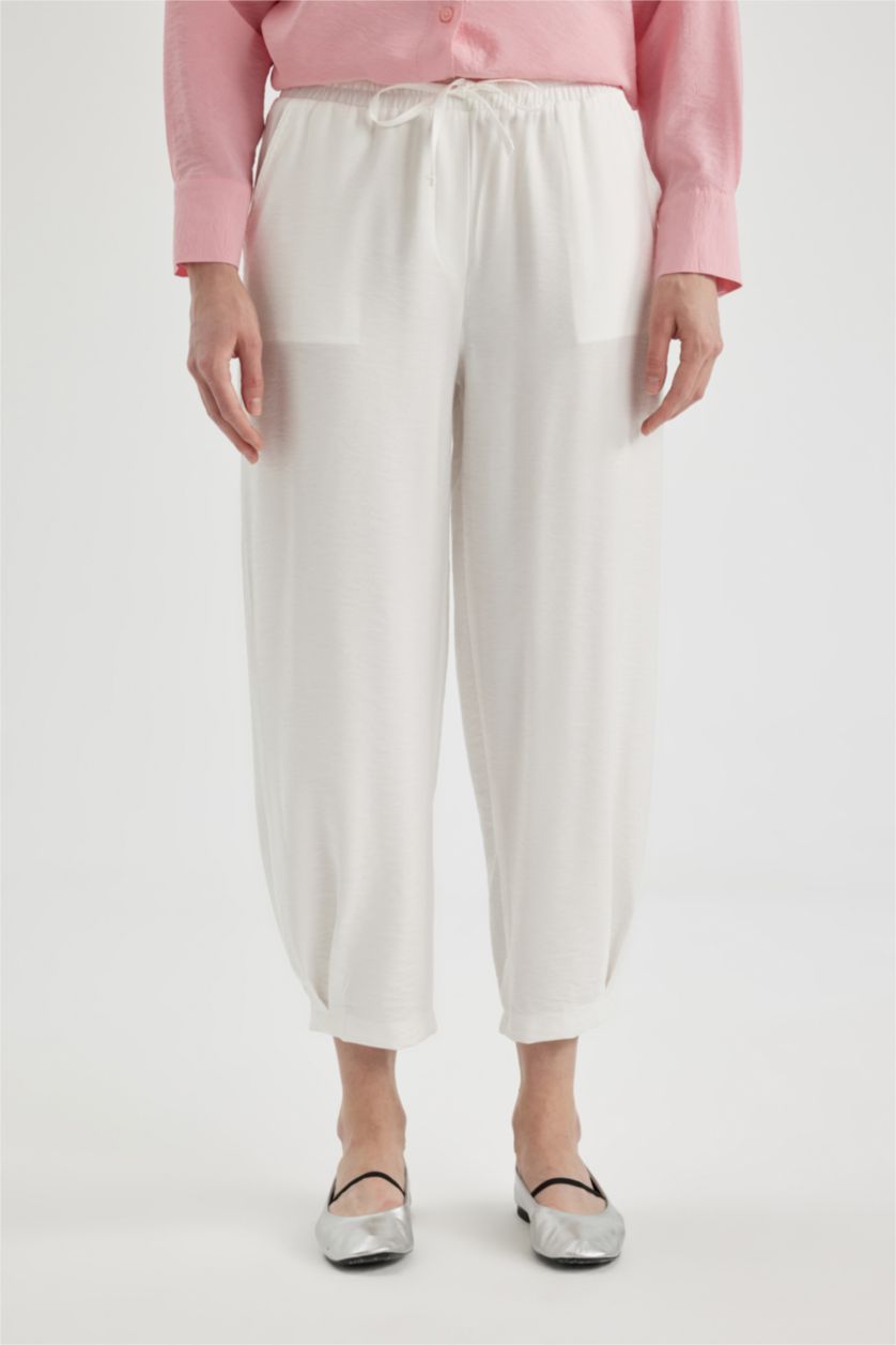 نساء بيج فاتح سروال قصة عادية