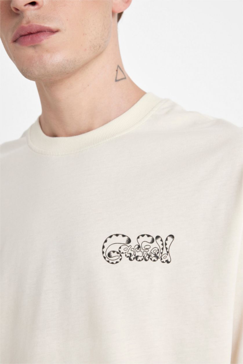 Erkek Kum %100 Pamuk Garfield Boxy Fit Bisiklet Yaka Sırt Baskılı Kısa Kollu Tişört