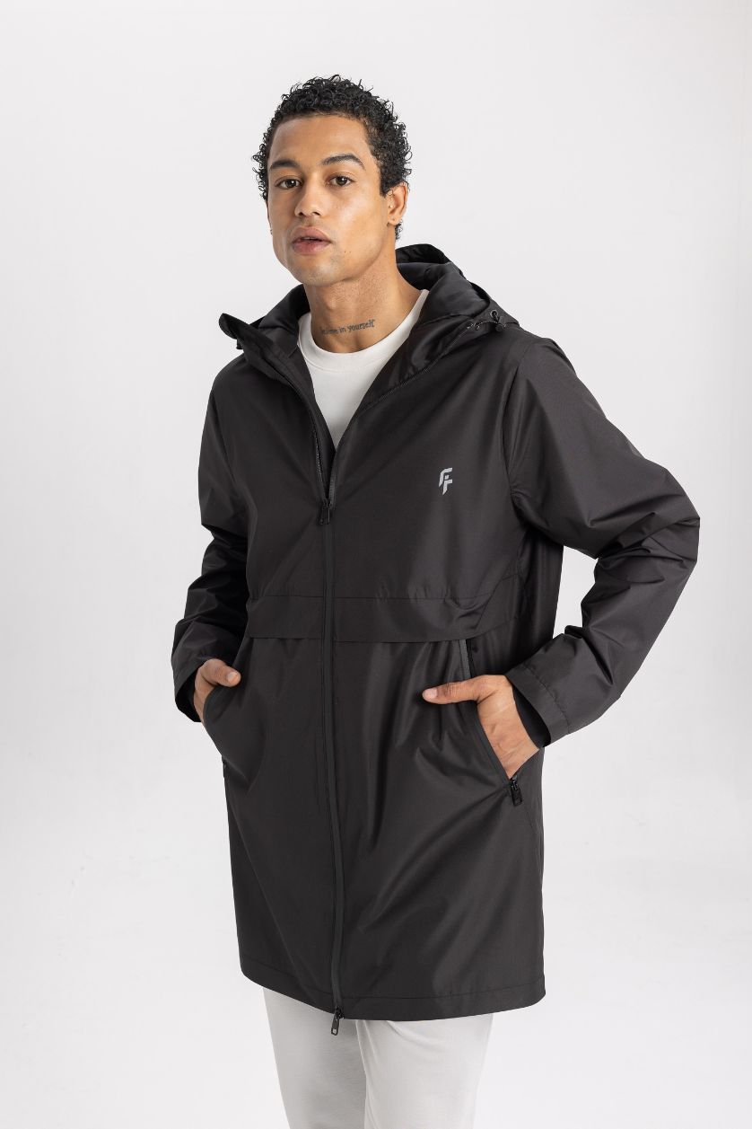 رجال أسود بالطو مطر قصة عادية بغطاء للرأس طارد للماء من DeFactoFit