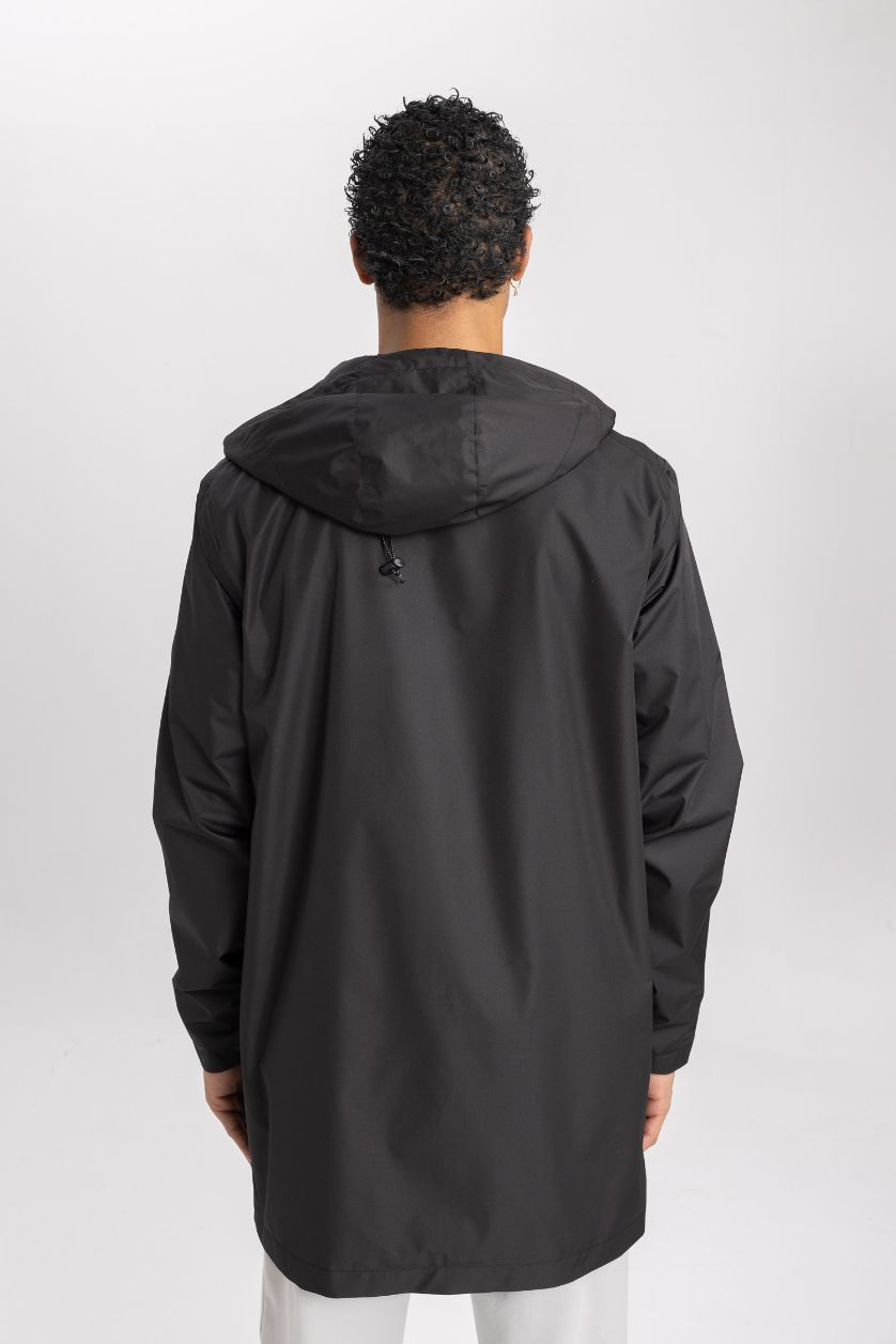 رجال أسود بالطو مطر قصة عادية بغطاء للرأس طارد للماء من DeFactoFit