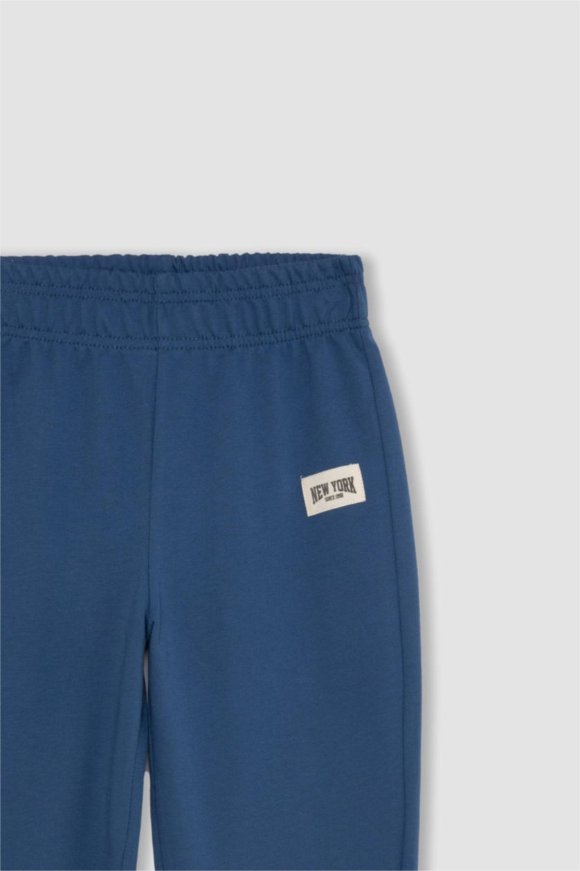 Kız Çocuk - Genç Kız İndigo Kız Çocuk Dokuma Etiketli Beli ve Paçası Lastikli Jogger Eşofman Altı