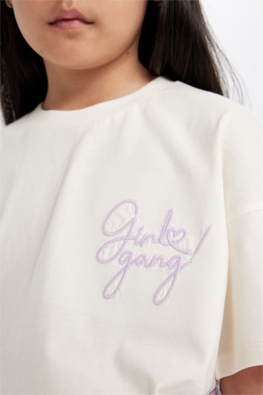 بنات بيج فاتح طقم تيشيرت بنات مطبوع و تنورة - قطعتين