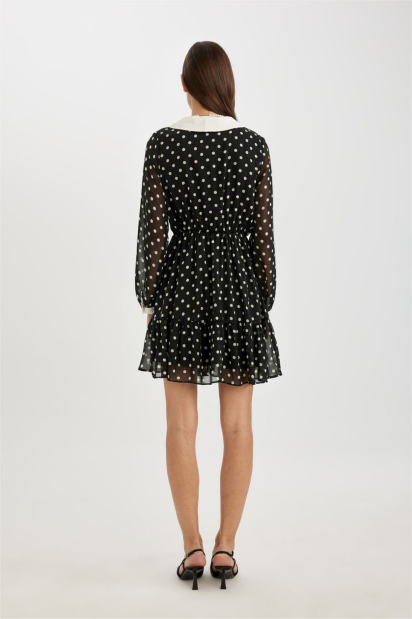 FEMME Noir Mini robe à manches longues en mousseline à pois