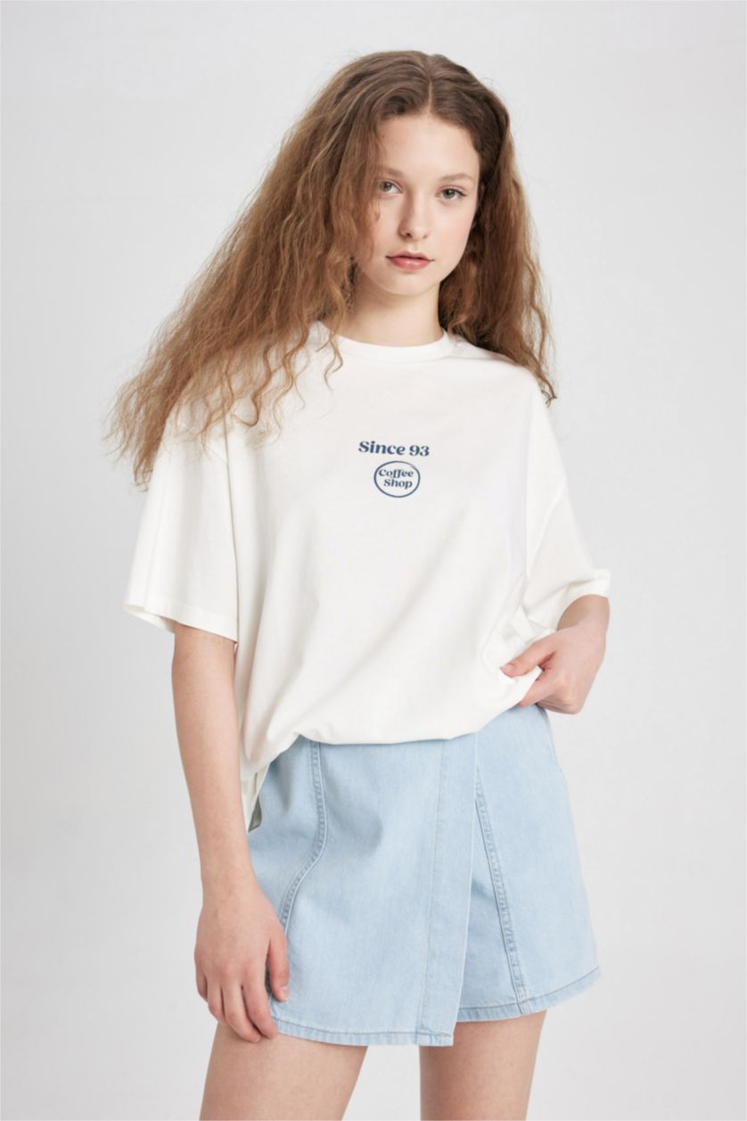 نساء أصفر فاتح تيشيرت اوفر سايز نص ردن بطبعة من الخلف