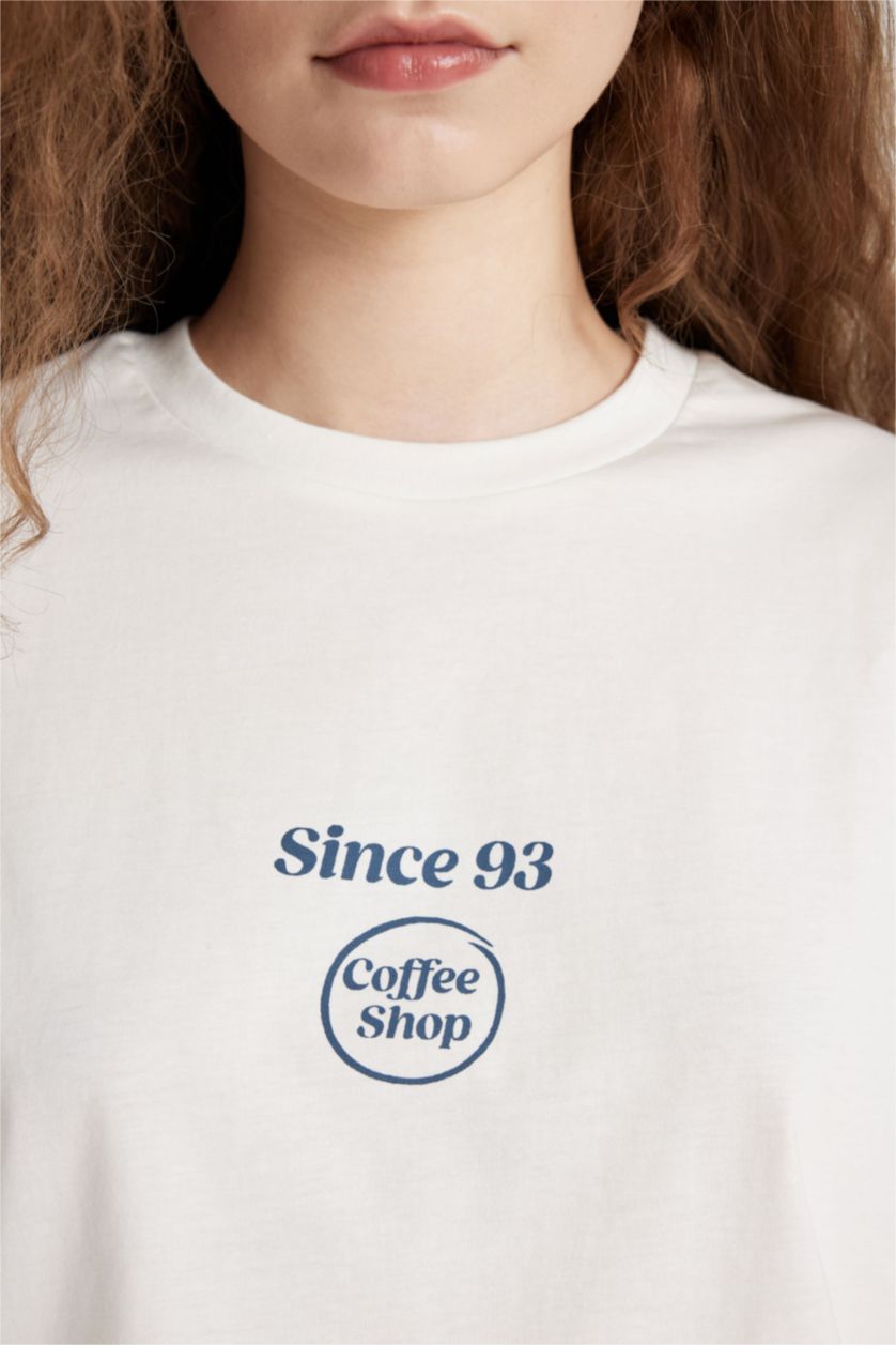 نساء أصفر فاتح تيشيرت اوفر سايز نص ردن بطبعة من الخلف