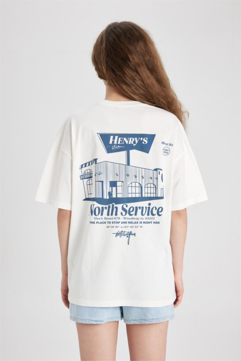 نساء أصفر فاتح تيشيرت اوفر سايز نص ردن بطبعة من الخلف