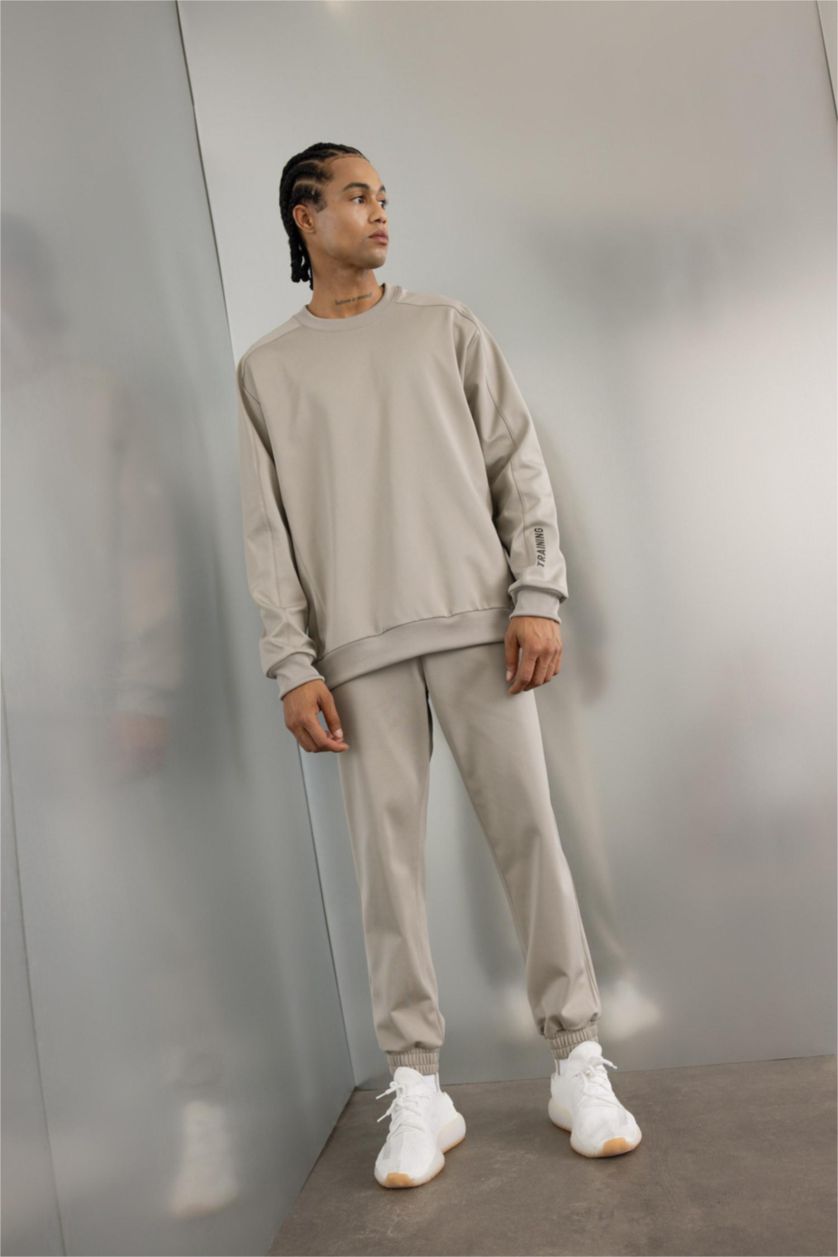 Erkek Gri Sporcu Jogger Eşofman Altı Loose Fit Beli Paçası Lastikli Cepli Pike