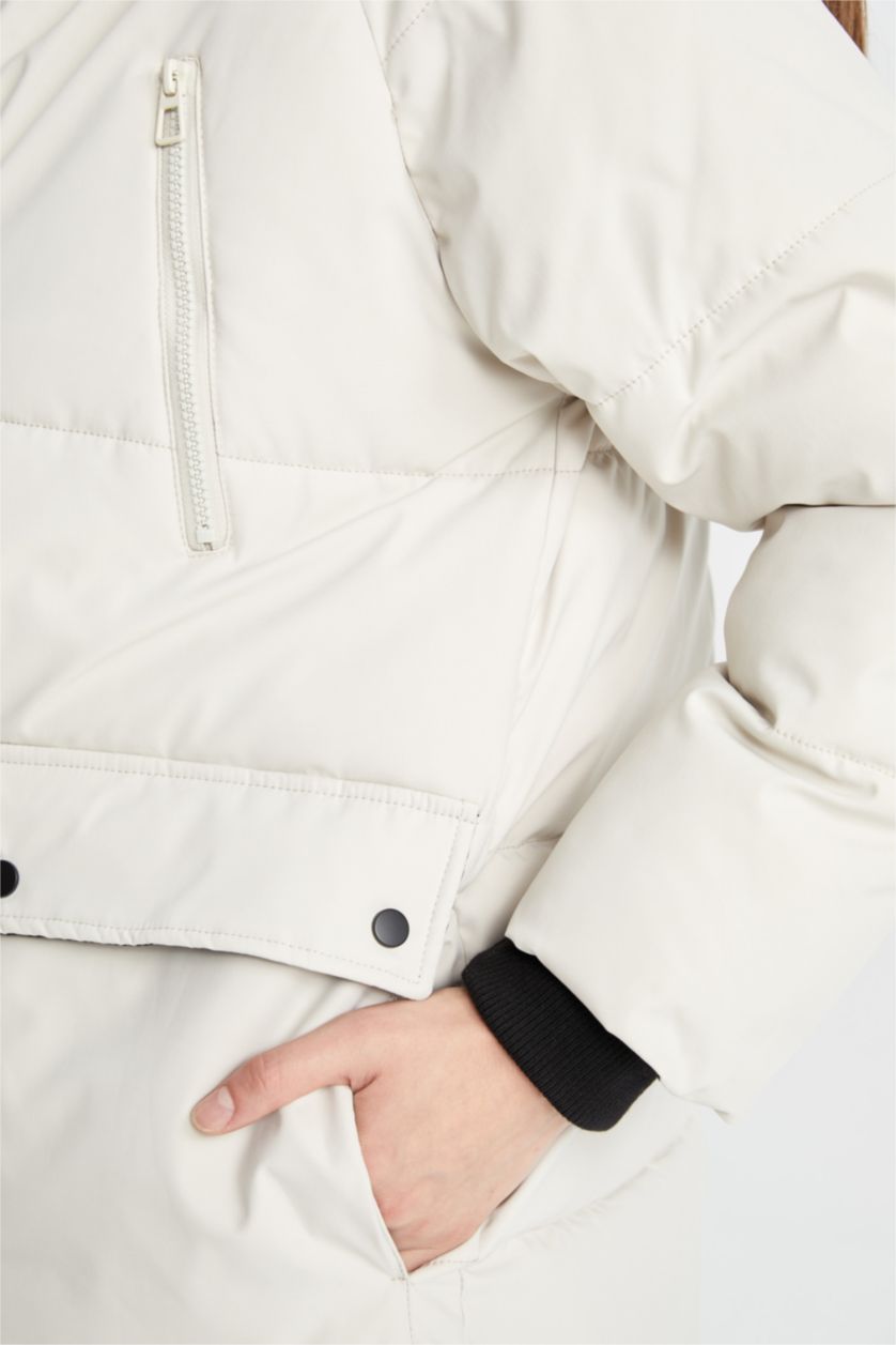 حريمي بيج فاتح جاكيت طويل تقيل قصة عادية بكابيشون وتر برووف