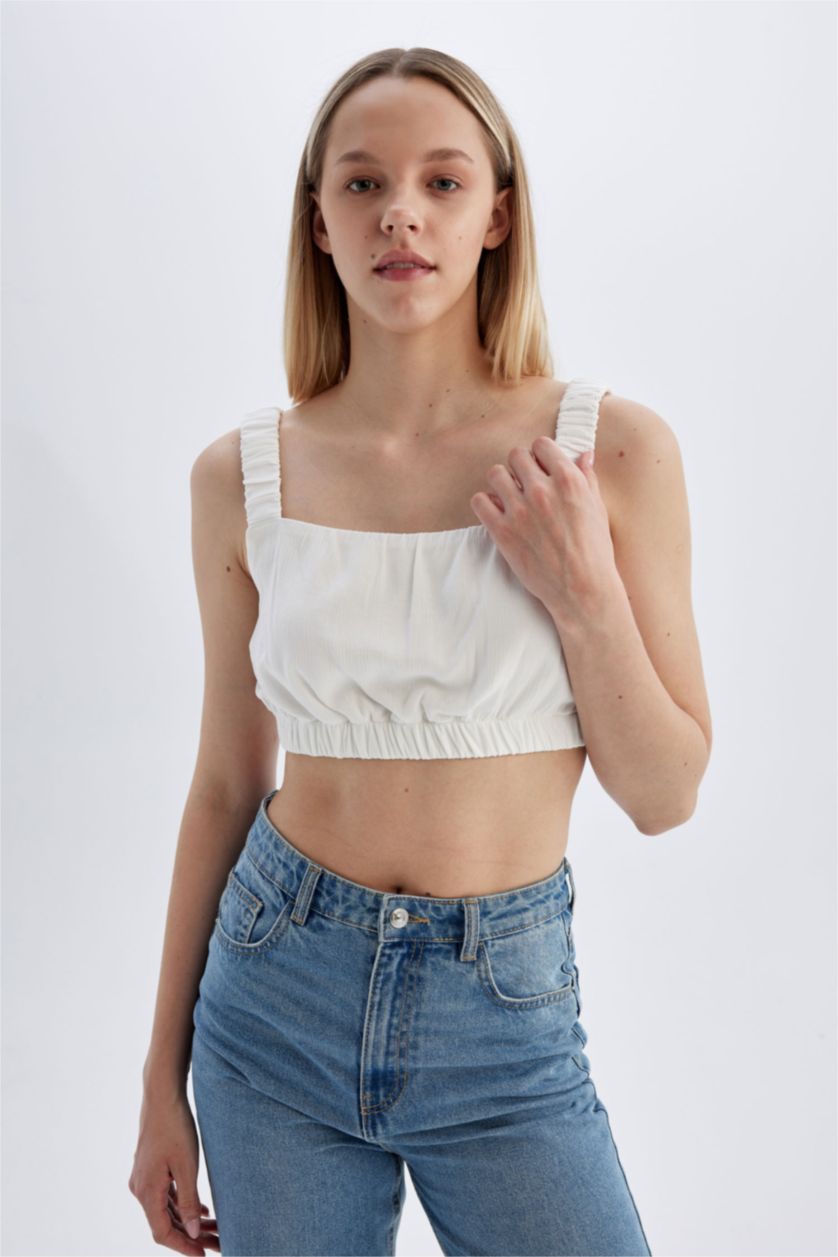 نساء اوف وايت بلوزة بدون ردن بحمالات