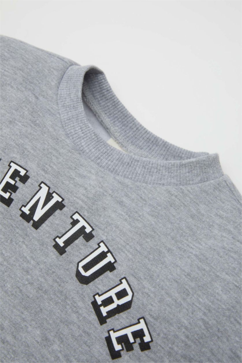 طفل صغير رمادي فاتح طقم بيبي اولادي سويت شيرت وسويت بانتس بطبعة شعار - قطعتين