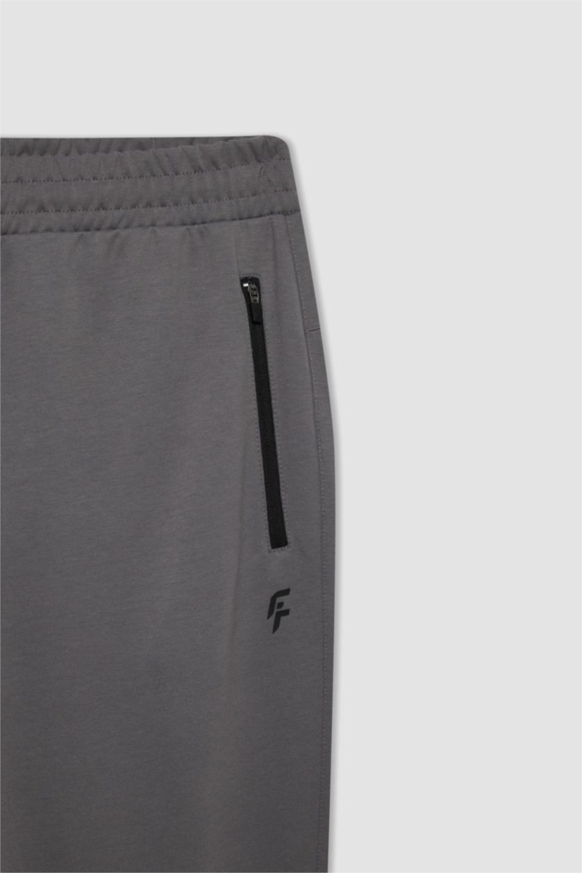 Erkek Gri DeFactoFit Sporcu Jogger Eşofman Altı Slim Fit Dar Kesim Beli Paçası Lastikli Cepli Basic Düz
