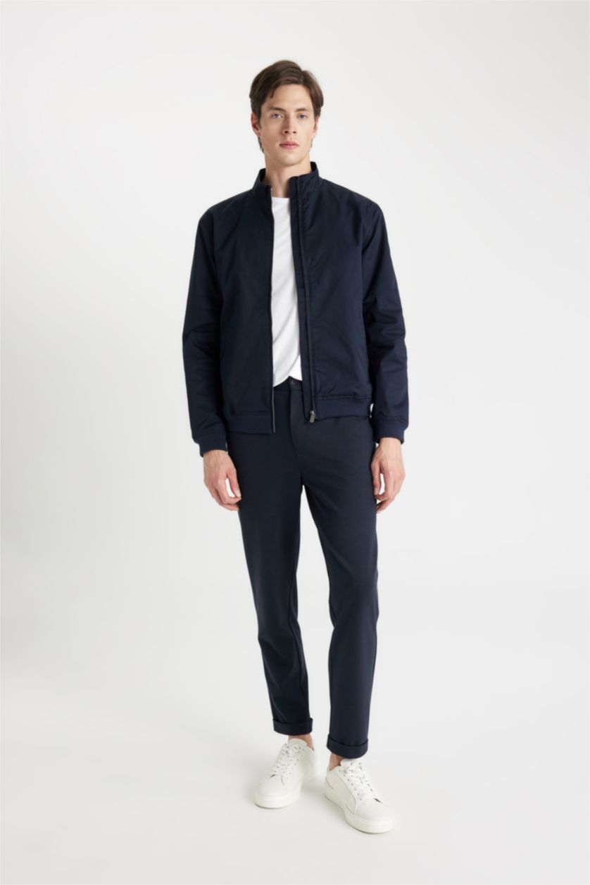 رجالي كحلي جاكيت خفيف سليم فيت بياقة عالية وتر برووف بجيوب بسوسته