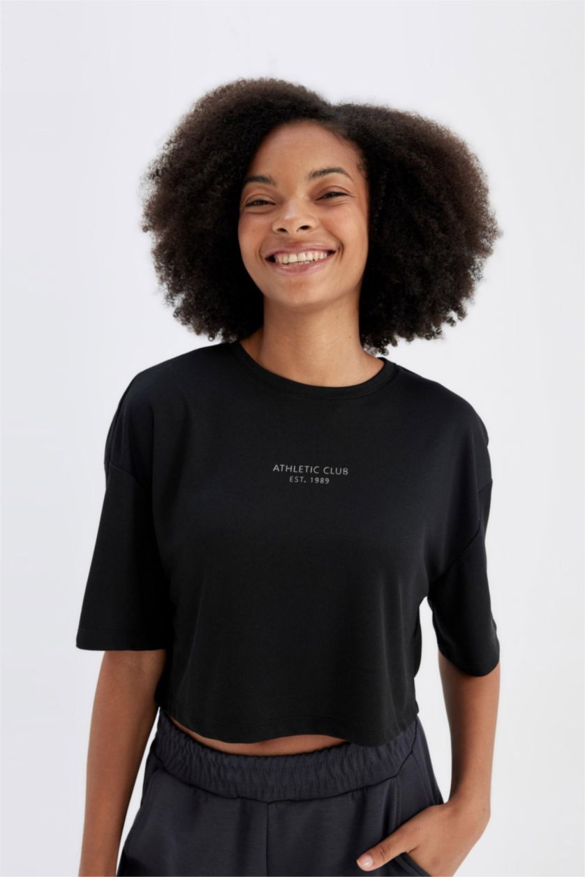 نساء أسود تيشيرت رياضي اوفر سايز نص ردن بطبعة شعار من DeFactoFit