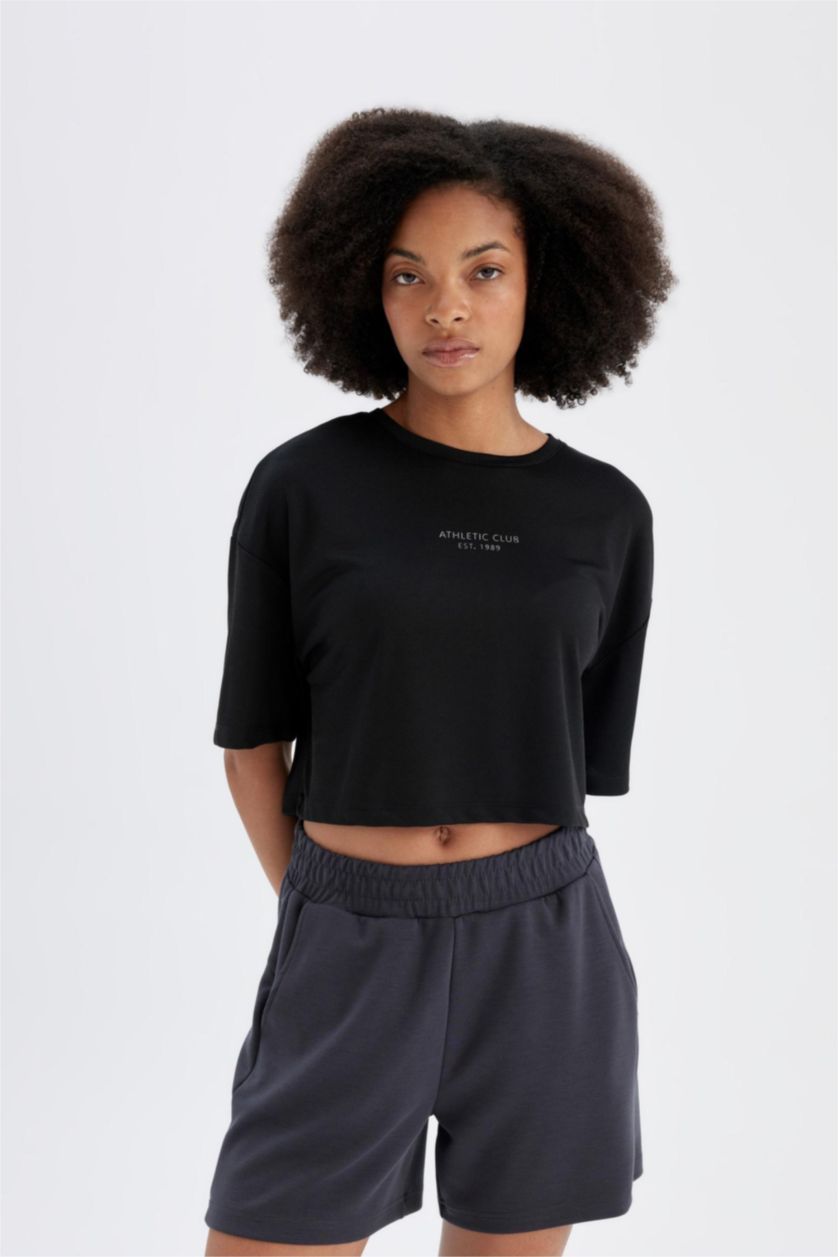 نساء أسود تيشيرت رياضي اوفر سايز نص ردن بطبعة شعار من DeFactoFit