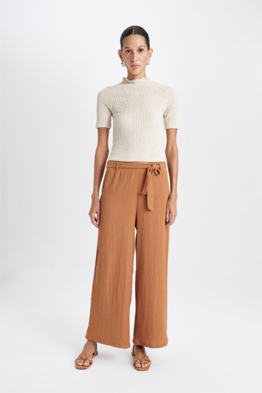 حريمي بني فاتح بنطلون كابري كولوت فيت برجل واسع