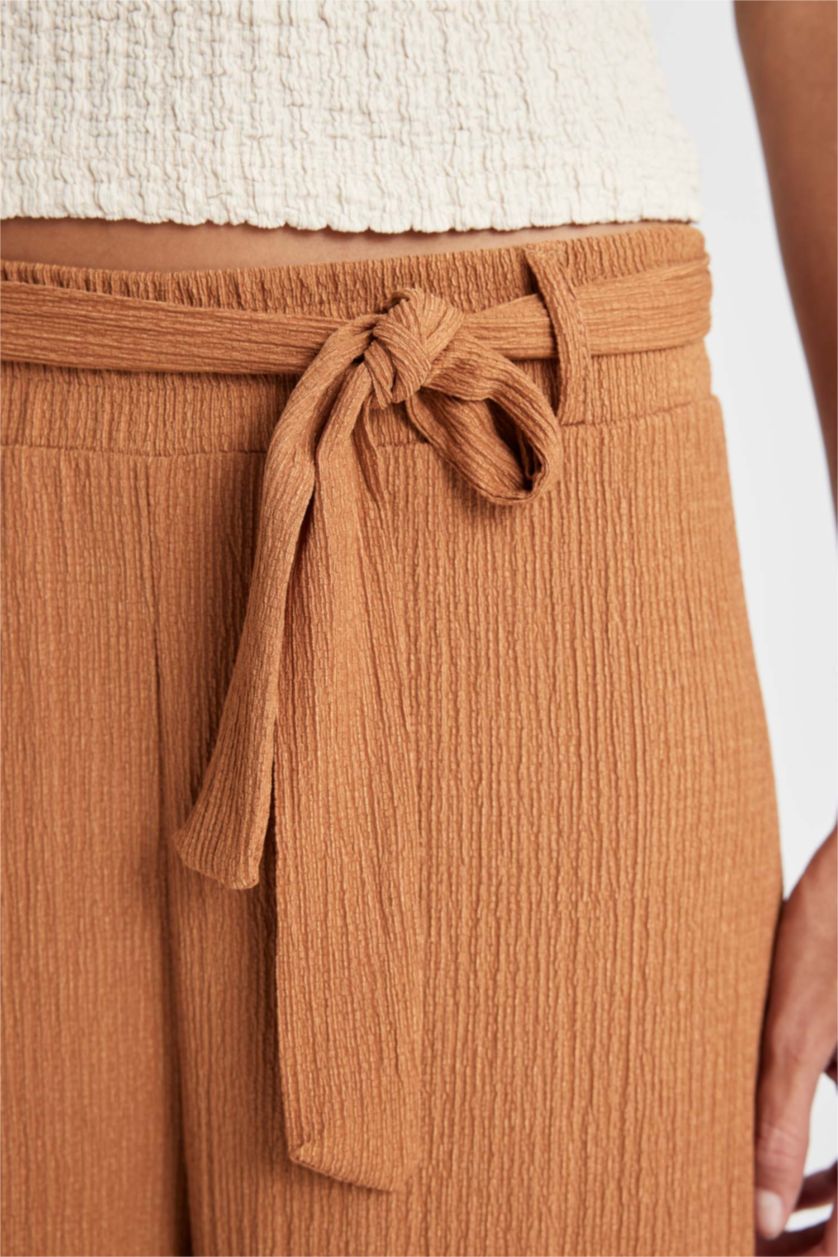 حريمي بني فاتح بنطلون كابري كولوت فيت برجل واسع