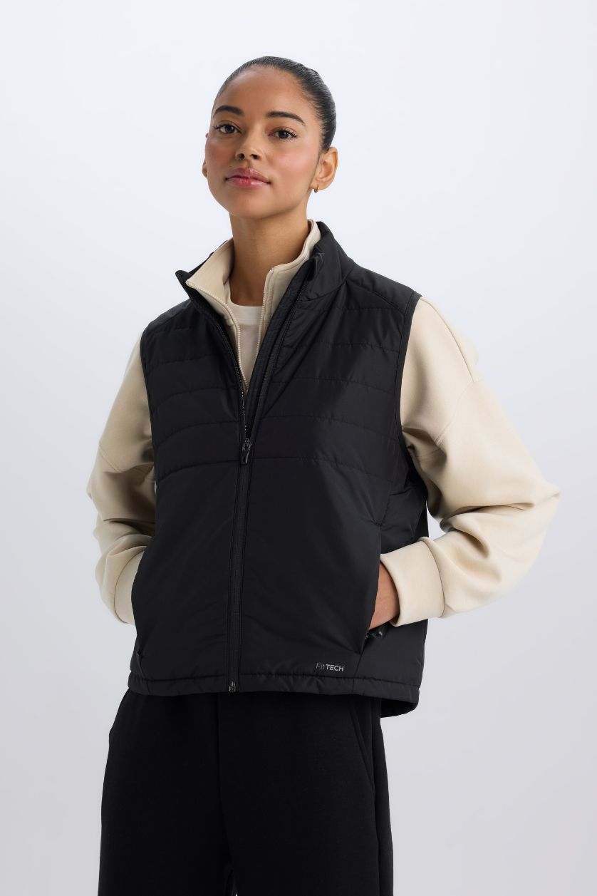 نساء أسود يلك نفخ رياضي قصة عادية بجيب مقاوم للماء من DeFactoFit