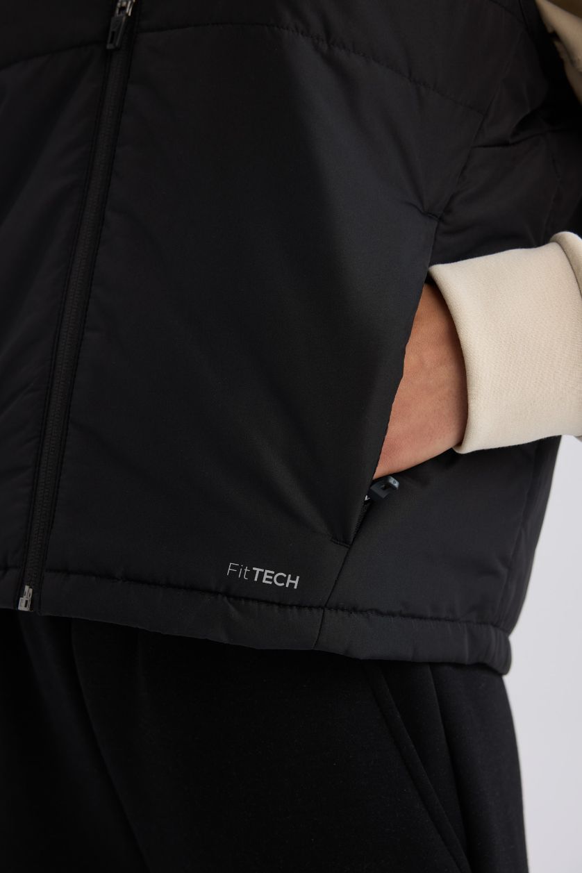 نساء أسود يلك نفخ رياضي قصة عادية بجيب مقاوم للماء من DeFactoFit