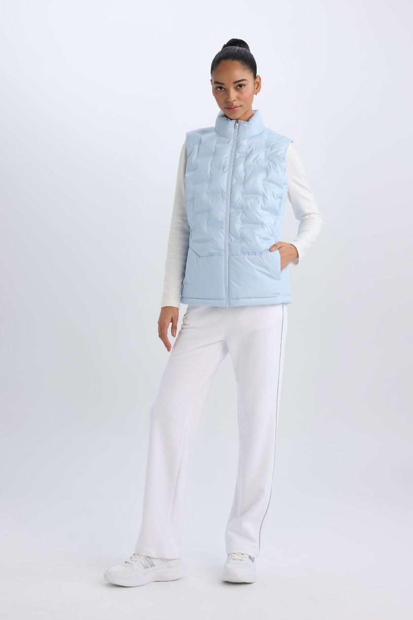 نساء أزرق فاتح يلك نفخ رياضي قصة عادية بجيب مقاوم للماء من DeFactoFit