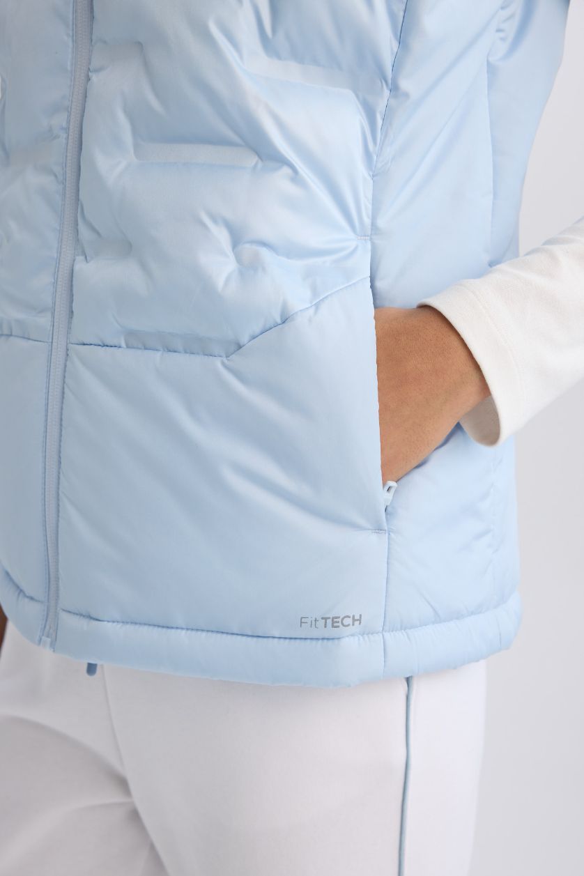 نساء أزرق فاتح يلك نفخ رياضي قصة عادية بجيب مقاوم للماء من DeFactoFit