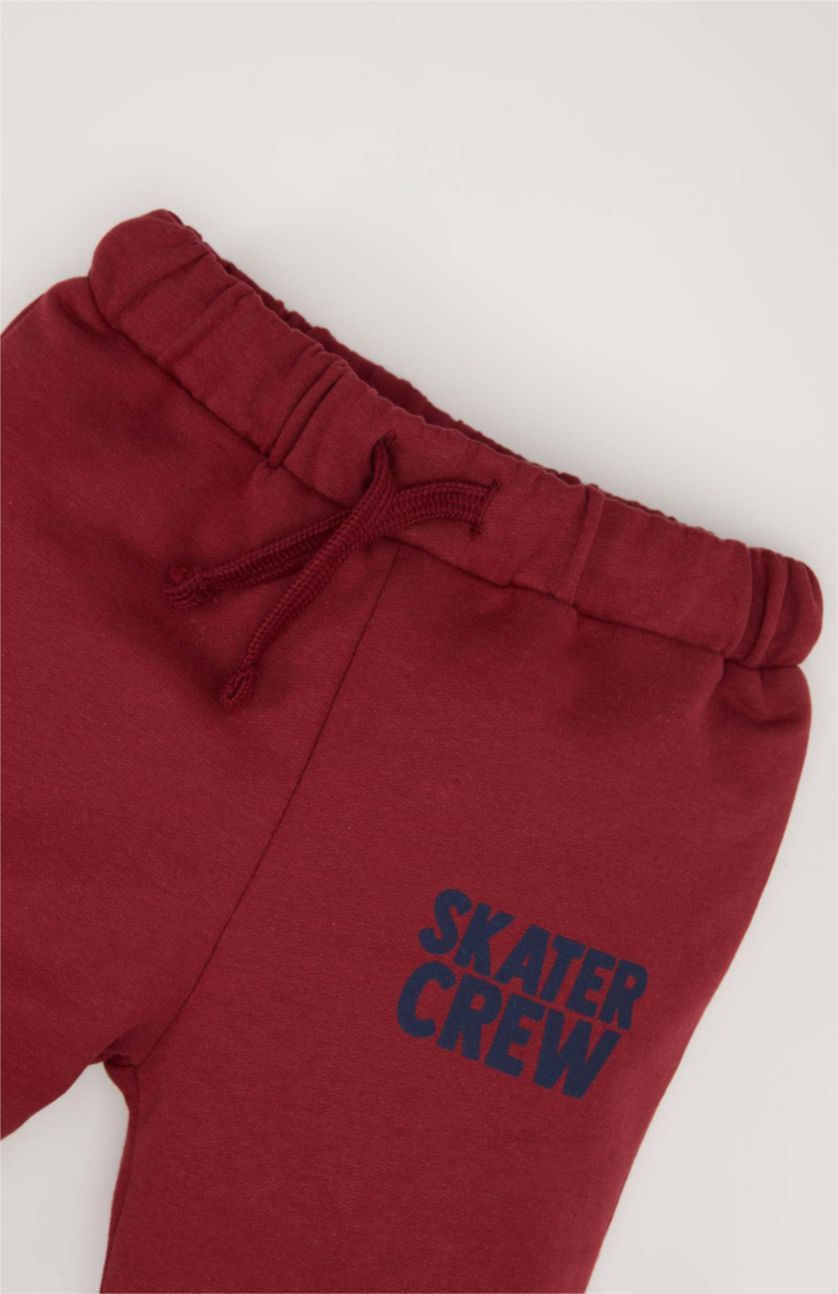 طفل صغير خمري بنطلون سويت بانتس بيبي اولادي بطبعة شعار وقصة عادية خمري