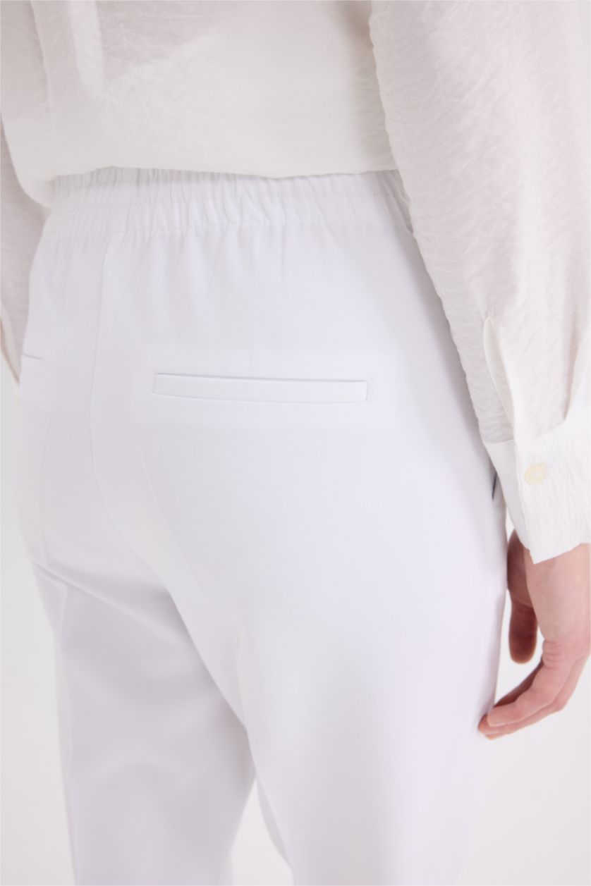 نساء اوف وايت بنطرون كاروت فيت برجل عادي بجيب وخصر عالي