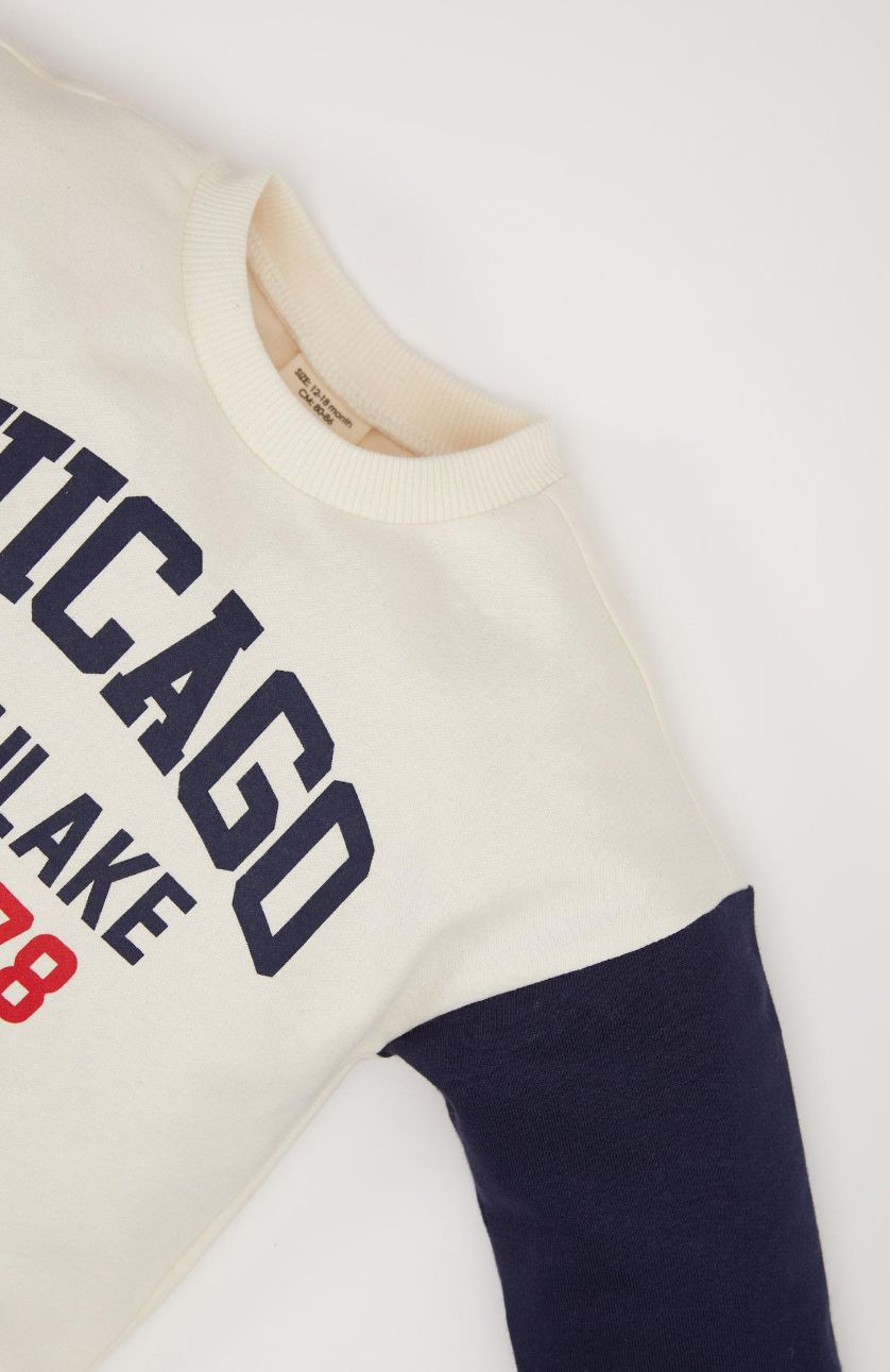 طفل صغير كحلي طقم بيبي اولادي سويت شيرت وسويت بانتس بطبعة شعار قصة عادية - قطعتين