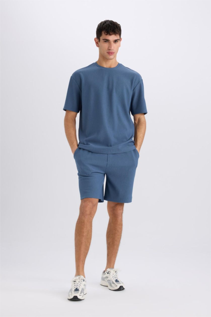 رجال نيلي فاتح تيشيرت نص كم أوفر سايز برقبة مستديرة