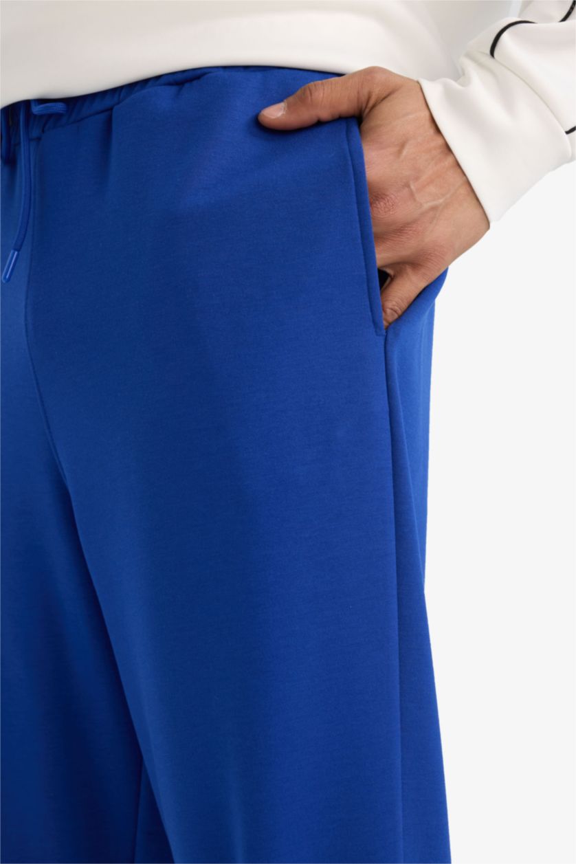 رجال أزرق فاقع بنطلون بجامة رياضي قماش سكوبا قصة عادية برجل مطاطي من DeFactoFit