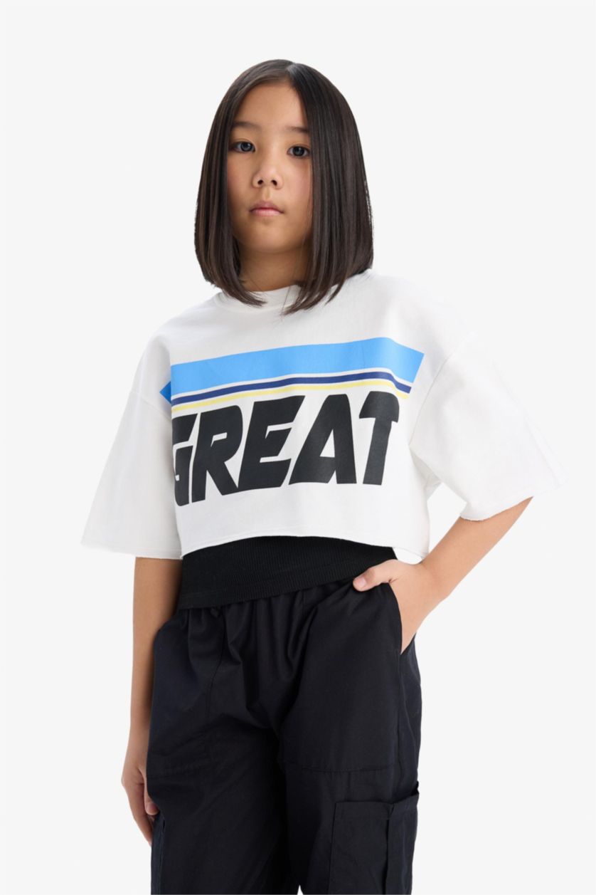 بنات بيج فاتح تيشيرت بناتي نص ردن بطبعة شعار بياخة مستديرة