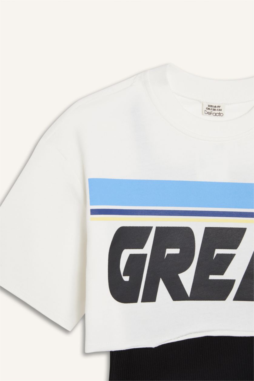 بنات بيج فاتح تيشيرت بناتي نص ردن بطبعة شعار بياخة مستديرة