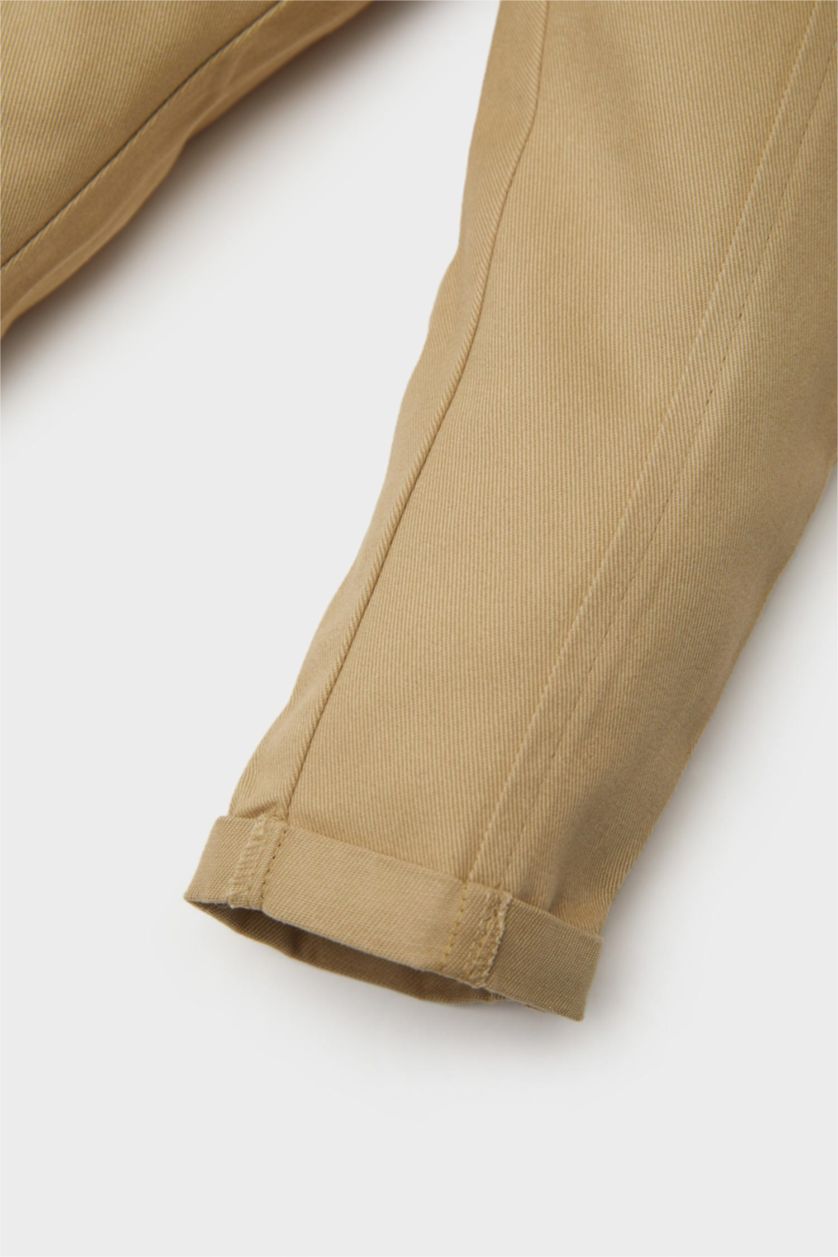 مولود ذكر بيج فاتح طقم من قميص أولاد مخطط بأكمام طويلة و سروال