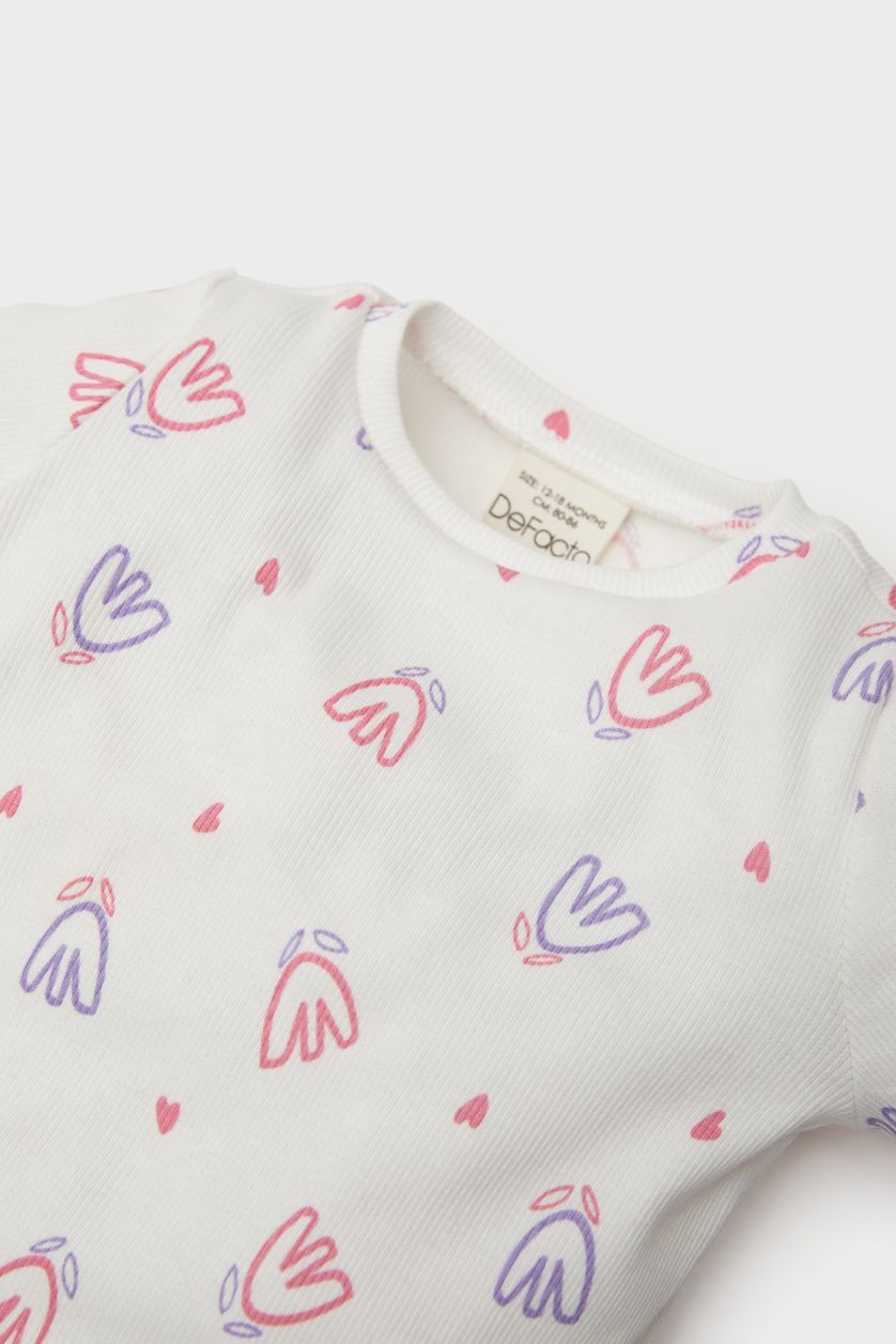 طفلة صغيرة بيج فاتح طقم من بودي بنات مضلع بطبعة زهور برقبة مستديرة و سروال