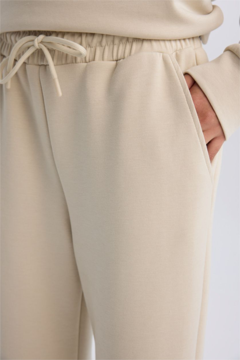 Kadın Kum Standart Fit Uzun İnce Jogger Eşofman Altı Cepli Beli Paçası Lastikli