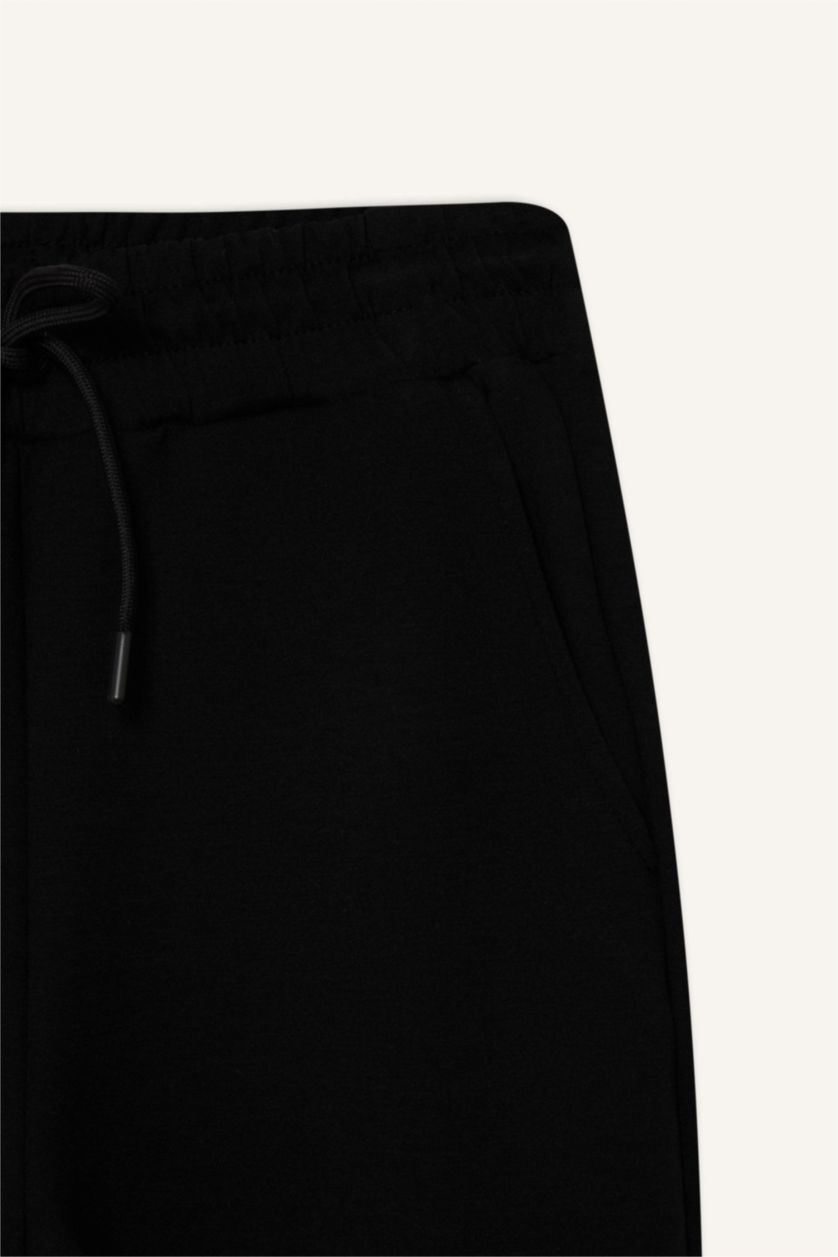 Kadın Siyah Standart Fit Uzun İnce Jogger Eşofman Altı Cepli Beli Paçası Lastikli