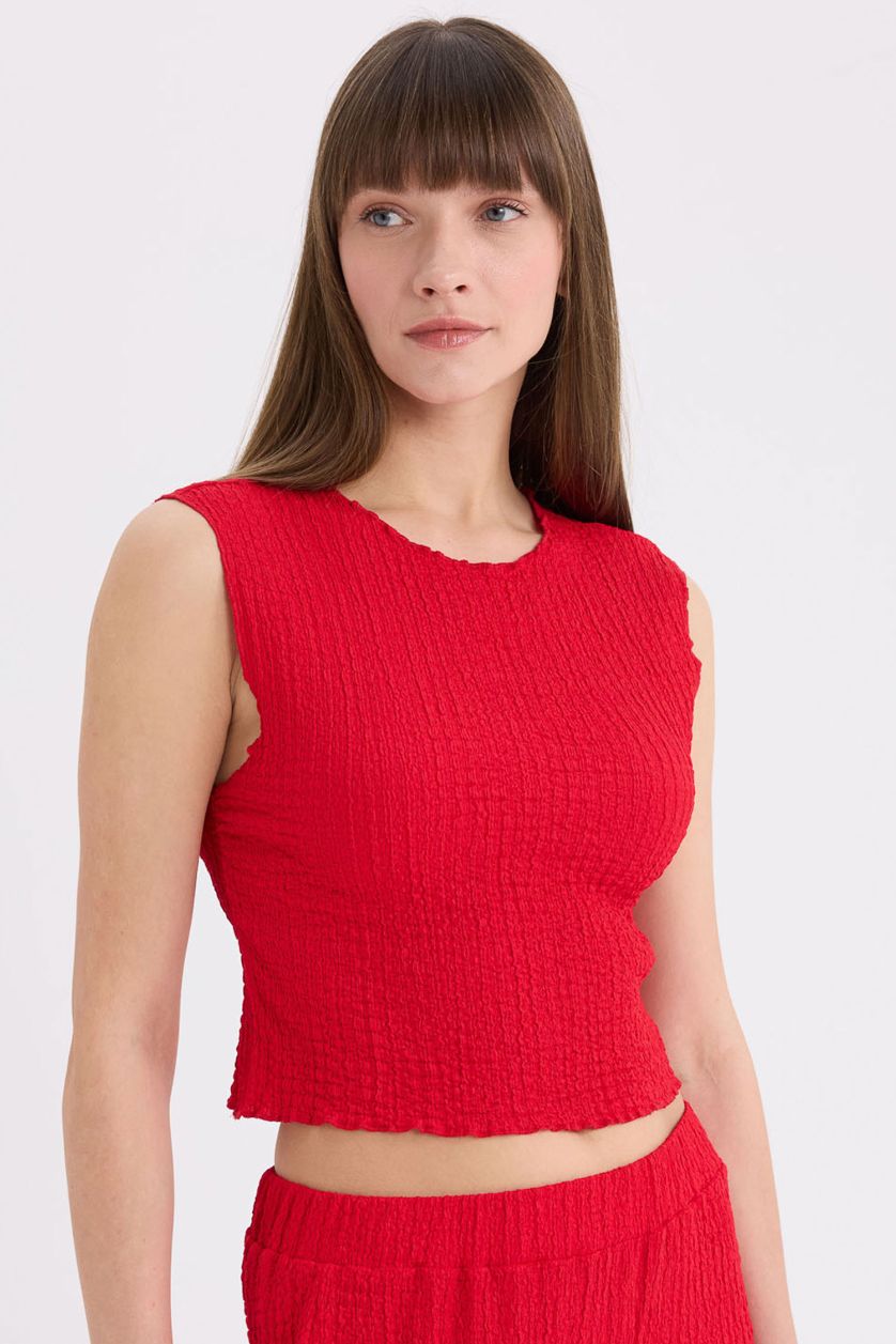 FEMME Rouge Pantalon large en tissu gaufré